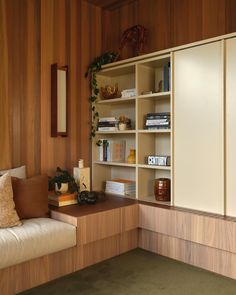 a living room filled with furniture and wooden walls