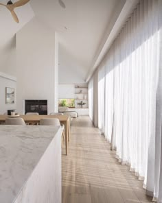 an open floor plan with white walls and wood floors is shown in this modern home