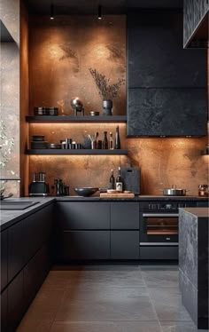 a kitchen with black cabinets and shelves filled with pots, pans and utensils