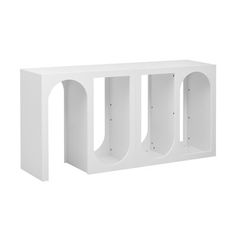 a white shelf with three shelves on each side and two holes in the middle for storage