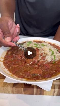 a man is cutting into a large bowl of food