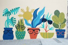 a wall painted with potted plants and glasses