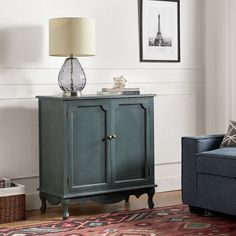 a living room scene with focus on the sideboard and chair, which has a lamp on top