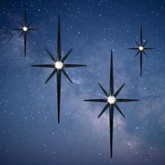 three star shaped objects floating in the air