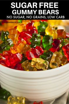 a bowl filled with gummy bears sitting on top of a table