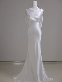 a white dress on display in a room