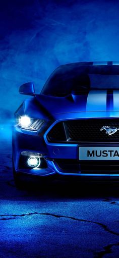 the front end of a blue mustang car