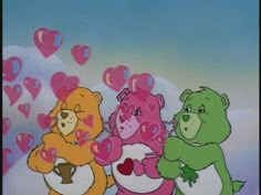 three teddy bears with hearts flying in the air