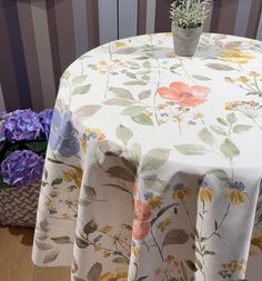 a table with a flowered cloth on it