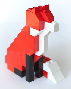 a red and white dog made out of legos