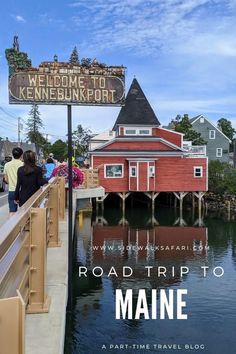 people are walking on the boardwalk next to water and a sign that says road trip to maine