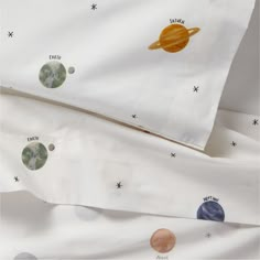 two sheets with planets printed on them