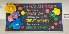 a bulletin board with flowers on it in a classroom setting that reads great attitude becomes a great month become a great year