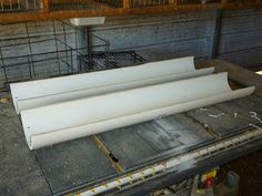 three pieces of white plastic sitting on top of a truck