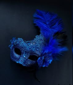 The brocade lace design with feathers adds a touch of sophistication and the jewels are carefully placed to catch the light and enhance your beauty. Securely and comfortably fits every face shape so you can enjoy a perfect evening at the masquerade ball.

Age Group/Gender - Adult/Women

Size/Type - One size fits all adults

Mask Color - Blue

Mask Material - Polyresin/Fabric

Accent Material - Gems Party Aesthetic Blue, Winter Masquerade Ball, Carte Aesthetic, Blue Mask Masquerade Ball, Royal Blue Masquerade Mask, Masquerade Mask Ideas, Masquerade Party Aesthetic, Blue Venetian Masquerade Mask For Party, Scenarios Ideas