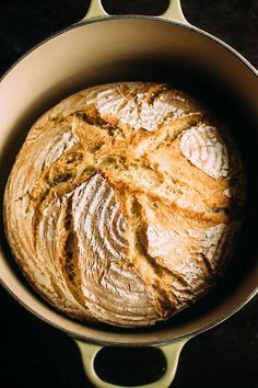 a loaf of bread sitting in a pan on top of a table