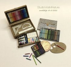 an assortment of art supplies including crayons, pencils, and other items