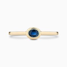 The Ecksand Oval-Cut Blue Sapphire Stackable Ring shown with  in 14k Yellow Gold Printable Ring Size Chart, Stackable Gemstone Rings, Types Of Diamonds, Gemstone Engagement, 18k Yellow Gold Ring, Stackable Ring, Recycled Gold, Gemstone Engagement Rings, Brilliant Diamond