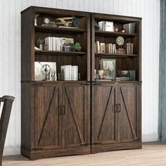 a wooden bookcase with sliding doors on the front and side, in a living room