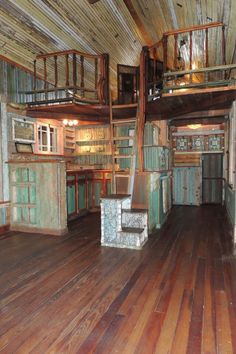 an old fashioned kitchen with wooden floors and stairs