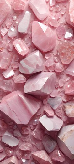 pink crystals are scattered on top of each other