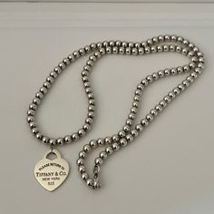 Tiffany & Co. Bead Center Heart Necklace In Excellent Condition Comes With Pouch And Box Ask Question Tiffany Co Necklaces, Tiffany And Co Gold, Heart Necklace Tiffany, Gold Beaded Necklace, Jewelry Tiffany, Thick Necklace, Tiffany And Co Necklace, Gold Bead Necklace, Tiffany Co Jewelry