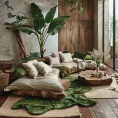 a living room filled with lots of furniture and plants on top of the rugs