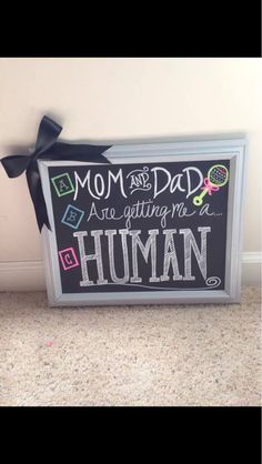 a sign that says mom and dad are getting my human