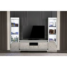 an entertainment center with glass shelves and a flat screen tv mounted on it's side