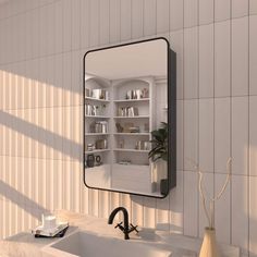 a bathroom sink sitting under a mirror in front of a wall mounted shelf filled with books