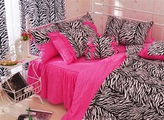 pink and black bedding with zebra print on the sheets, pillowcases and pillows