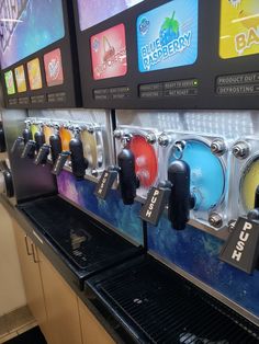 a row of vending machines sitting next to each other on top of a counter