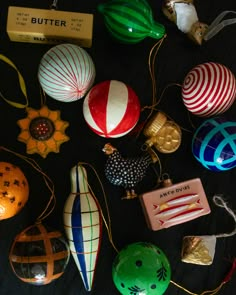 some ornaments are laying out on the table together and ready to be used as decorations