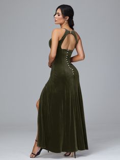 a woman in a green dress with an open back