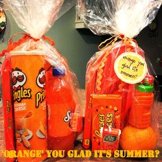 two orange juice bottles wrapped in plastic bags, with the words orange you glad it's summer written on them