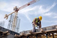 a construction worker working on the roof of a building