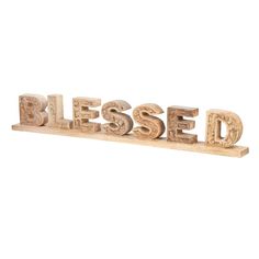 the word blessing spelled in wood letters on a white background with clipping for text