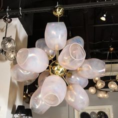 a chandelier hanging from the ceiling in a room