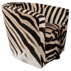 a zebra print chair sitting on top of a white floor