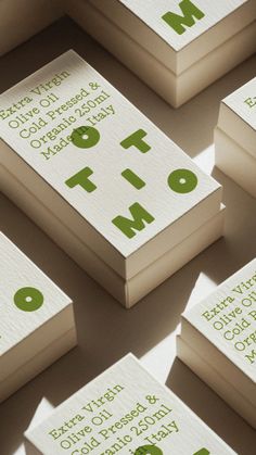 several folded business cards with the words top ten printed on them, all in green and white