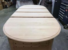 a long wooden table sitting in a warehouse