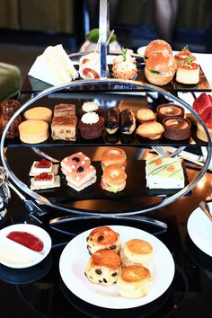 an assortment of pastries and desserts are on display