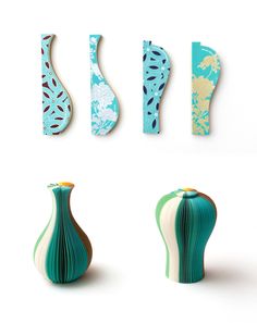 four vases with different designs on them are shown in the same color and shape