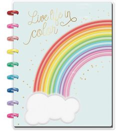 a notebook with a rainbow on the cover