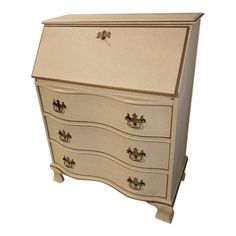 a white dresser with drawers and knobs on it