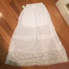 Beautiful White Maxi Skirt With Lace Detailing. Has A Mini Skirt Liner. Chic Skirt With Lace Trim For Vacation, Chic Lace Trim Skirt For Vacation, Stretch Skirt For Spring Beach Outing, Long Skirt For Beach And Spring, Long Skirt For Beach In Spring, Long Skirt For Beach And Spring Season, Spring Flared Maxi Skirt With Lace Trim, Chic Vacation Skirt With Lace Trim, Chic Lace Trim Maxi Skirt For Summer