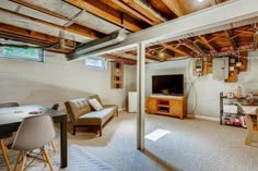 a living room filled with furniture and a flat screen tv