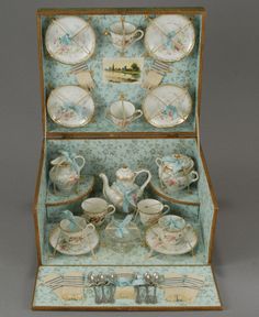 an antique porcelain tea set in a box