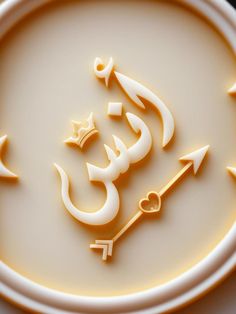 a white plate topped with an arabic writing on it's side next to a fork and knife