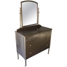 a dresser with a mirror on top of it and drawers under the bottom drawer, against a white background